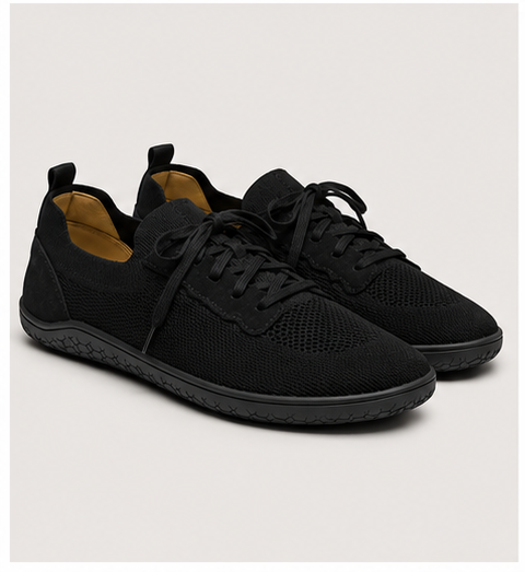 Men's black barefoot shoes by LOUNGERS, side view of Vector model showcasing sleek design and flexible sole.